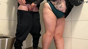 Hairy MILF masturbates in public restroom